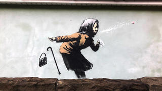 10.12.2020, Großbritannien, Bristol: Ein Graffiti ist auf einer Wand in der Vale Street aufgetaucht sind. Es könnte sich um das neueste Kunstwerk des Straßenkünstlers Banksy handeln, obwohl der schwer zu fassende Straßenkünstler noch nicht bestätigt hat, ob er das Wandbild gemalt hat. Foto: Claire Hayhurst/PA Wire/dpa - ACHTUNG: Nur zur redaktionellen Verwendung und nur mit vollständiger Nennung des vorstehenden Credits +++ dpa-Bildfunk +++