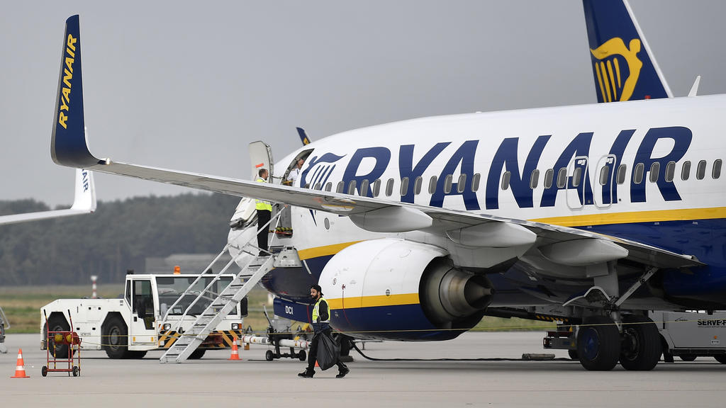 FILE - In this Sept. 12, 2018 file photo, a Ryanair plane parks at the airport in Weeze, Germany. Boeing's troubled 737 Max jet is getting a vote of confidence from Ireland's Ryanair, one of Europe's biggest budget airlines.  Ryanair announced Thursd