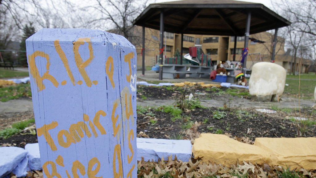 FILE â€“ In this Dec. 29, 2015, file photo, "R.I.P. Tamir Rice" is written on a wooden post near a makeshift memorial at the gazebo where the boy was fatally shot, outside the Cudell Recreation Center in Cleveland. The Justice Department announced Tu