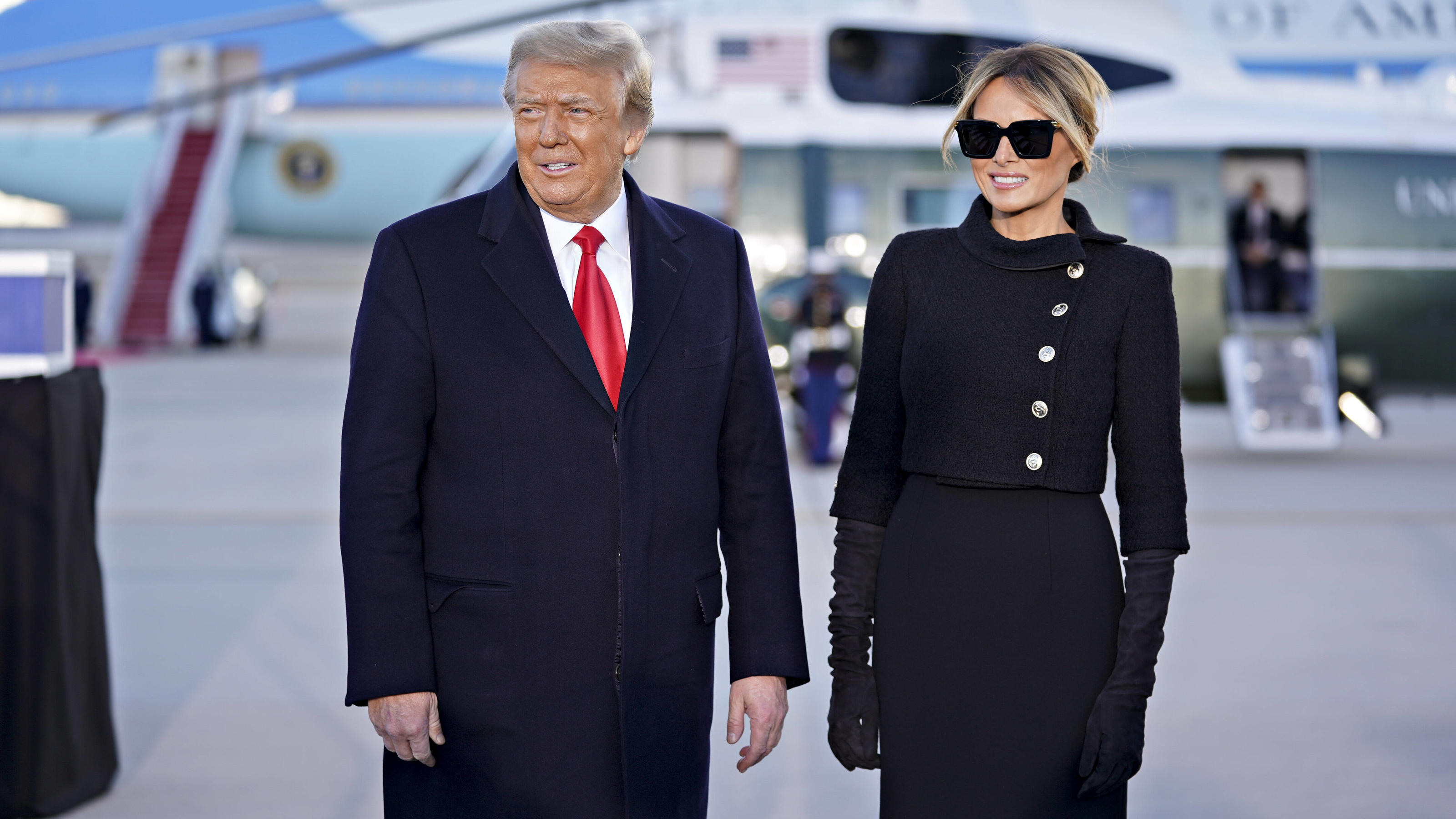  U.S. President Donald Trump, left, and U.S. First Lady Melania Trump arrive to a farewell ceremony at Joint Base Andrews, Maryland, U.S., on Wednesday, Jan. 20, 2021. Trump departs Washington with Americans more politically divided and more likely t