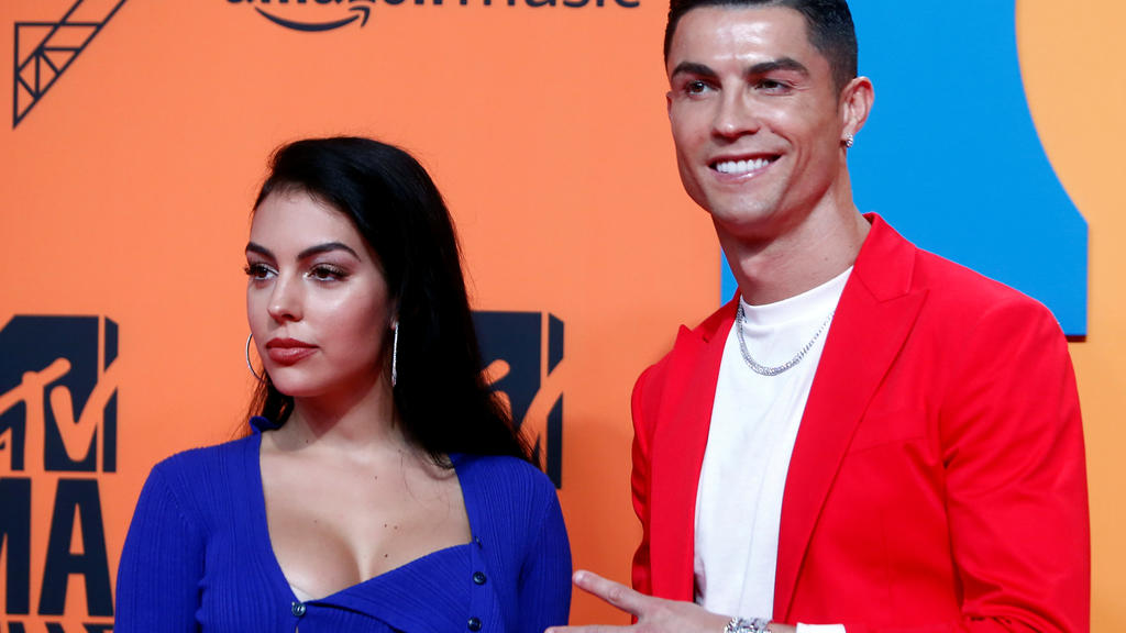 FILE PHOTO: Cristiano Ronaldo and Georgina Rodriguez pose on a red carpet as they arrive at the 2019 MTV Europe Music Awards at the FIBES Conference and Exhibition Centre in Seville, Spain, November 3, 2019. REUTERS/Jon Nazca/File Photo
