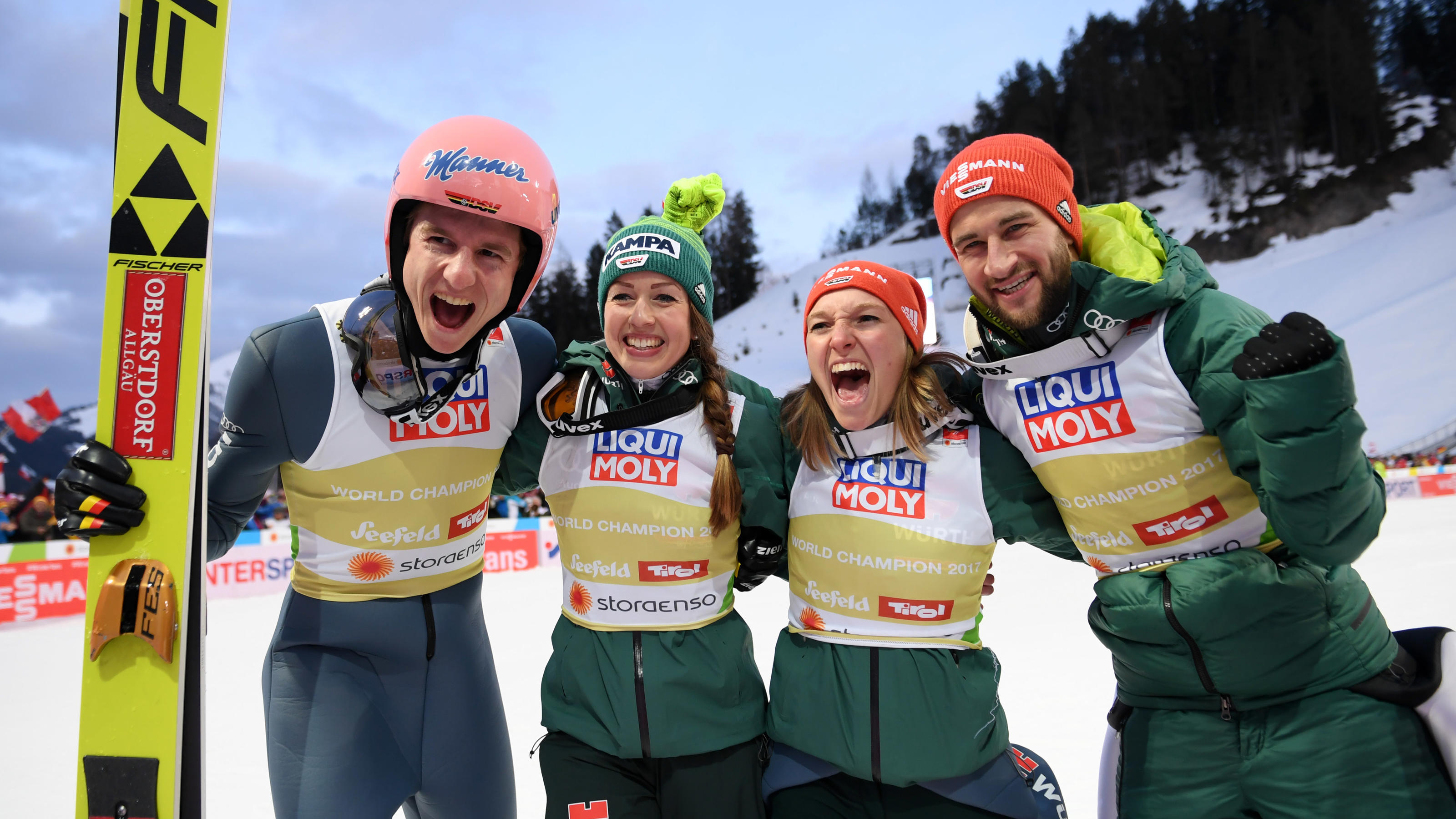 SEEFELD, AUSTRIA - MARCH 02: Karl Geiger of Germany, Katharina Althaus of Germany, Markus Eisenbichler of Germany and Juliane Seyfarth of Germany celebrates following their victory in the Mixed Team Ski Jumping HS109 competition during the FIS Nordic