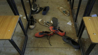 Shoes of the kidnapped students from Government Science Secondary School are seen inside their classroom Kankara, Nigeria, Wednesday, Dec. 16, 2020. Rebels from the Boko Haram extremist group claimed responsibility Tuesday for abducting hundreds of boys from the school in Nigeria's northern Katsina State in one of the largest such attacks in years, raising fears of a growing wave of violence in the region. (AP Photo/Sunday Alamba)