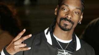 US rapper Snoop Dogg arrives at the 25th annual Brits Music Awards in London, Wednesday Feb. 9, 2005.  Pop and rock musicians gathered in London Wednesday for the 25th annual Brit Awards, industry-decided music awards.  (AP Photo/Adam Butler)