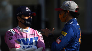 ABU DHABI, UNITED ARAB EMIRATES - DECEMBER 13: Sergio Perez of Mexico and Racing Point talks with Carlos Sainz of Spain and McLaren F1 on the grid prior to the F1 Grand Prix of Abu Dhabi at Yas Marina Circuit on December 13, 2020 in Abu Dhabi, United Arab Emirates. (Photo by Rudy Carezzevoli/Getty Images)