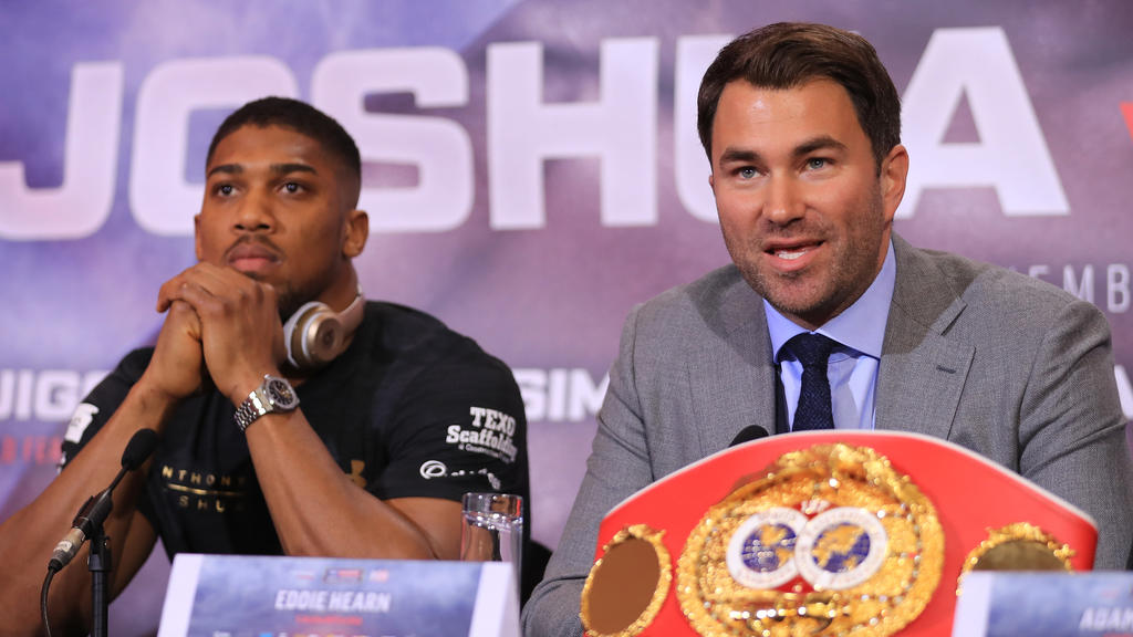 LONDON, ENGLAND - APRIL 27: Eddie Hearn, boxing promoter (R) and Anthony Joshua (L) speak during a press conference for his Super Heavyweight title fight against Wladamir Klitschko at Sky Sports Studios on April 27, 2017 in London, England. Anthony