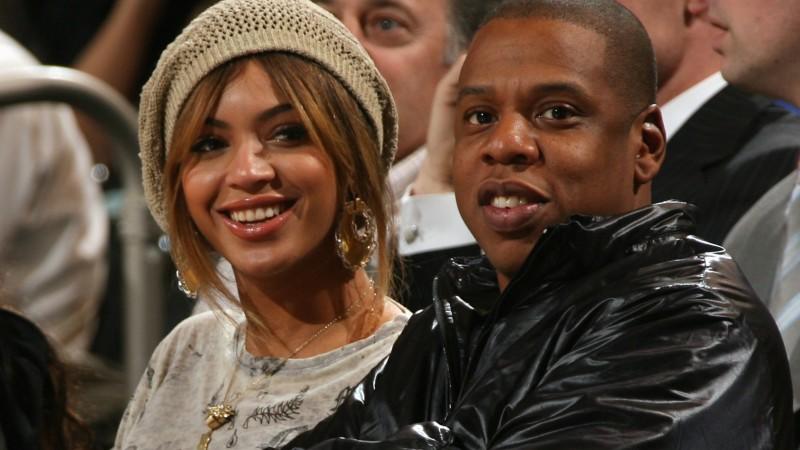 NEW YORK - APRIL 16:  Singer Beyonce Knowles and music producer Jay-Z sit courtside during the NBA game between the New York Knicks and the New Jersey Nets on April 16, 2007 at Madison Square Garden in New York City. The Nets won 104-95. NOTE TO USER: User expressly acknowledges and agrees that, by downloading and or using this photograph, User is consenting to the terms and conditions of the Getty Images License Agreement. Mandatory Copyright Notice: Copyright 2007 NBAE (Photo by Ned Dishman/NBAE via Getty Images)