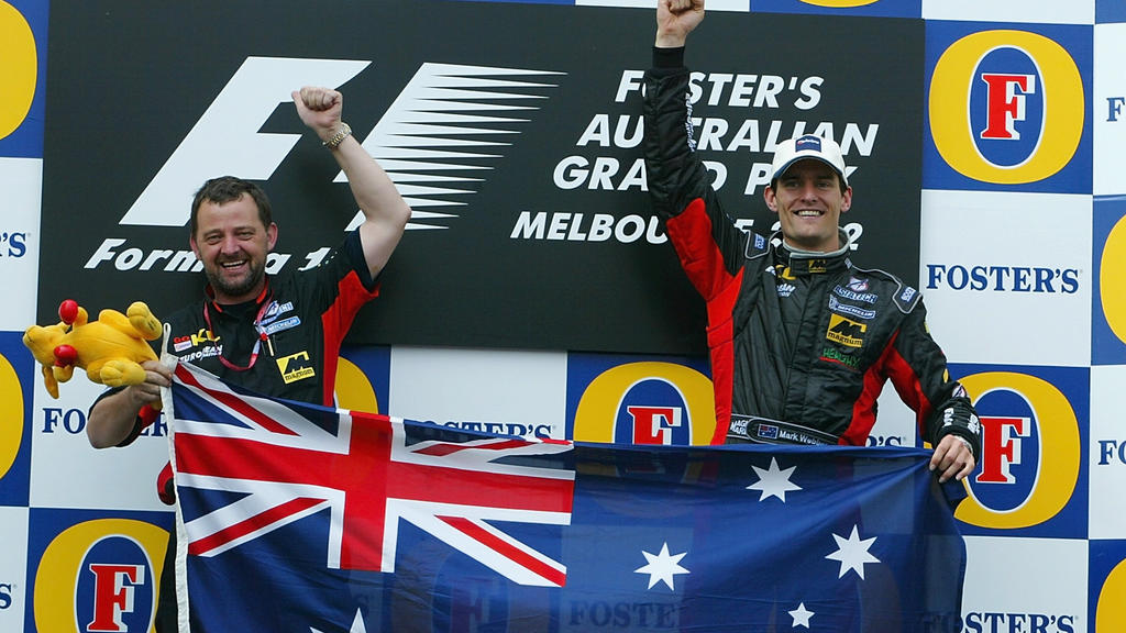 3 Mar 2002:  Mark Webber of Australia and Minardi celebrates with team boss Paul Stoddart after his 5th place finish in the 2002 Fosters Australian Grand Prix  at the Albert Park Circuit, Melbourne, Australia. DIGITAL IMAGE. Mandatory Credit: Mark Th