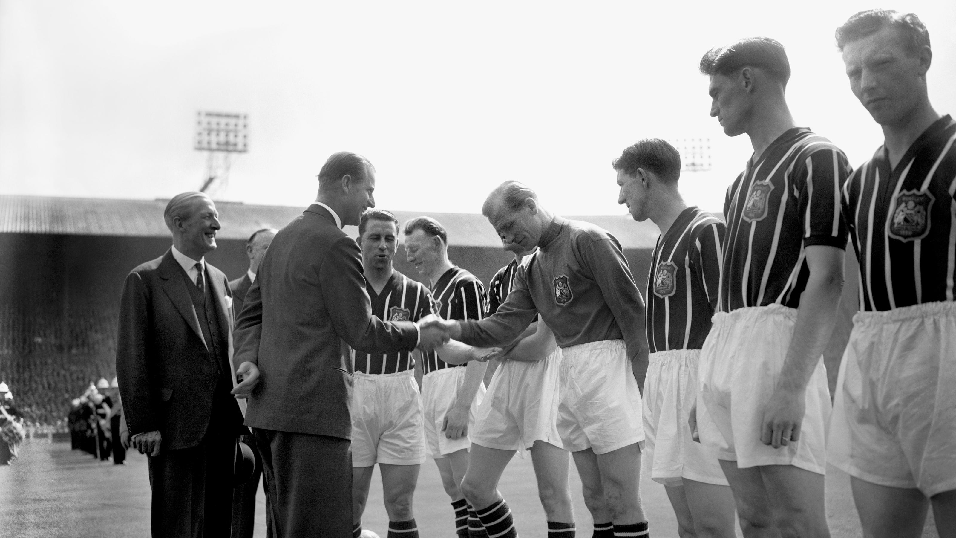 Duke of Edinburgh death. File photo dated 05/05/56 of The Duke of Edinburgh shaking hands with Manchester City's Footballer of the Year Bert Trautmann, before the FA Cup final at Wembley in London.