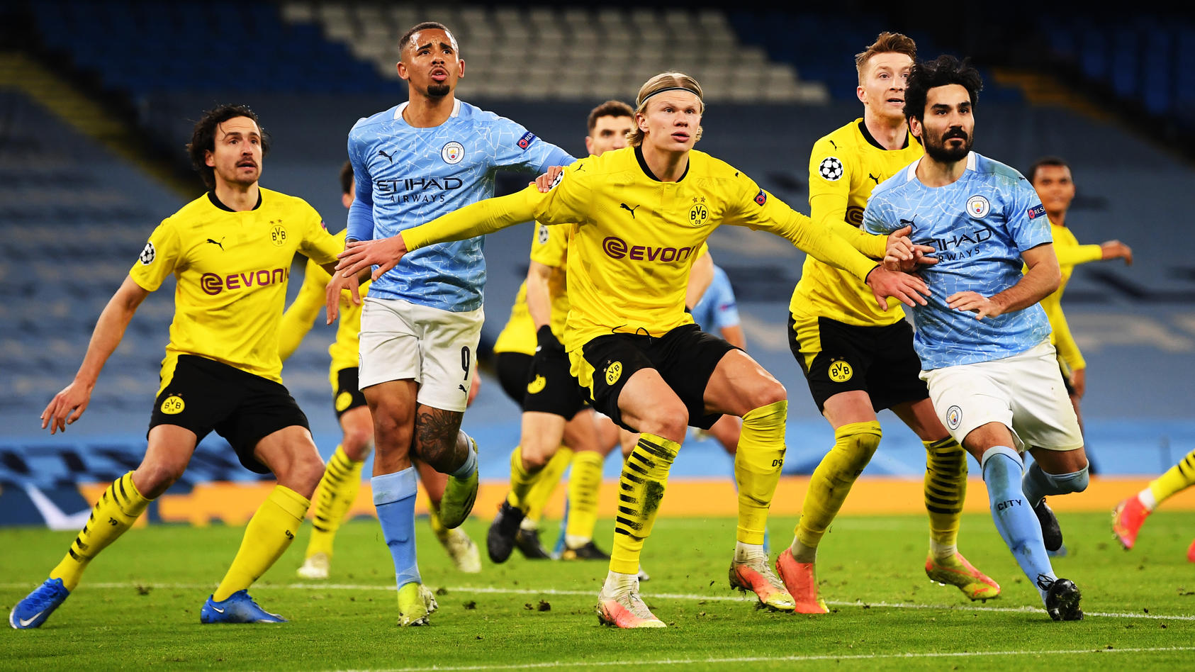 MANCHESTER, ENGLAND - APRIL 06: Erling Haaland of Borussia Dortmund battles with Gabriel Jesus (L) and Ilkay Guendogan (R) of Manchester City as they wait for the ball during the UEFA Champions League Quarter Final match between Manchester City and B