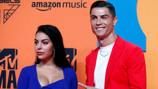 FILE PHOTO: Cristiano Ronaldo and Georgina Rodriguez pose on a red carpet as they arrive at the 2019 MTV Europe Music Awards at the FIBES Conference and Exhibition Centre in Seville, Spain, November 3, 2019. REUTERS/Jon Nazca/File Photo