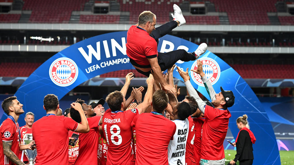 SPPORTUGAL-LISBON-FOOTBALL-UEFA CHAMPIONS LEAGUE-FINALS 200824 -- LISBON, Aug. 24, 2020 Xinhua -- Hans-Dieter Flick top, head coach of FC Bayern Munich, is thrown into the air by his players following their team s victory in the UEFA Champions Leagu