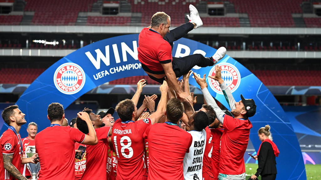  SPPORTUGAL-LISBON-FOOTBALL-UEFA CHAMPIONS LEAGUE-FINALS 200824 -- LISBON, Aug. 24, 2020 Xinhua -- Hans-Dieter Flick top, head coach of FC Bayern Munich, is thrown into the air by his players following their team s victory in the UEFA Champions Leagu