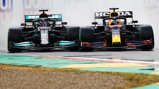 IMOLA, ITALY - APRIL 18: Max Verstappen of the Netherlands driving the (33) Red Bull Racing RB16B Honda and Lewis Hamilton of Great Britain driving the (44) Mercedes AMG Petronas F1 Team Mercedes W12 battle for track position at the start during the F1 Grand Prix of Emilia Romagna at Autodromo Enzo e Dino Ferrari on April 18, 2021 in Imola, Italy. (Photo by Bryn Lennon/Getty Images)