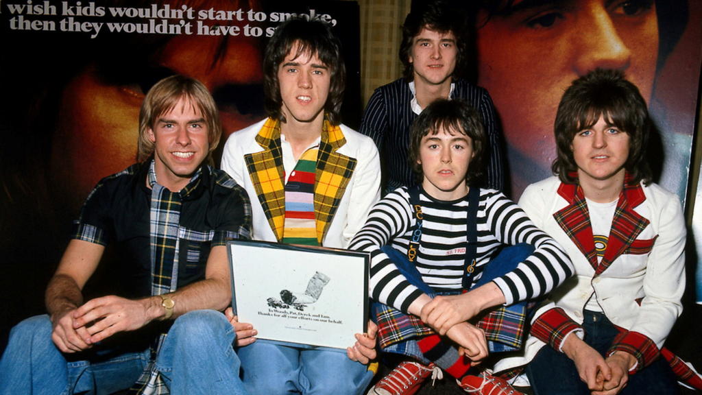 FILE PHOTO: FILE PHOTO DATED 1975 - Derek Longmuir, Alan Longmuir, Les McKeown (back), Ian Mitchell and Stewart Wood during an anti-smoking campaign launch in 1975./File Photo