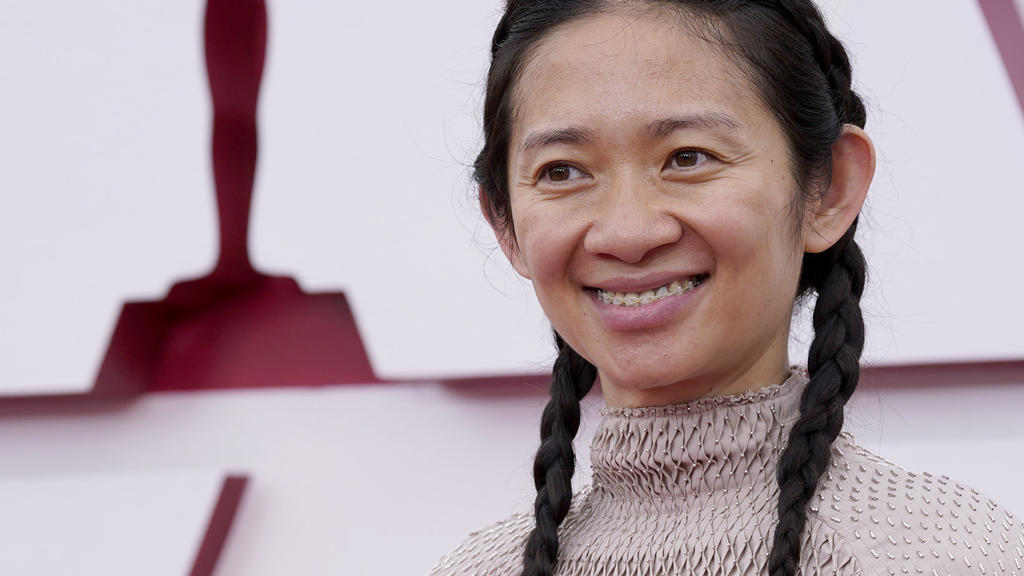Chloe Zhao arrives at the Oscars on Sunday, April 25, 2021, at Union Station in Los Angeles. (AP Photo/Chris Pizzello, Pool)