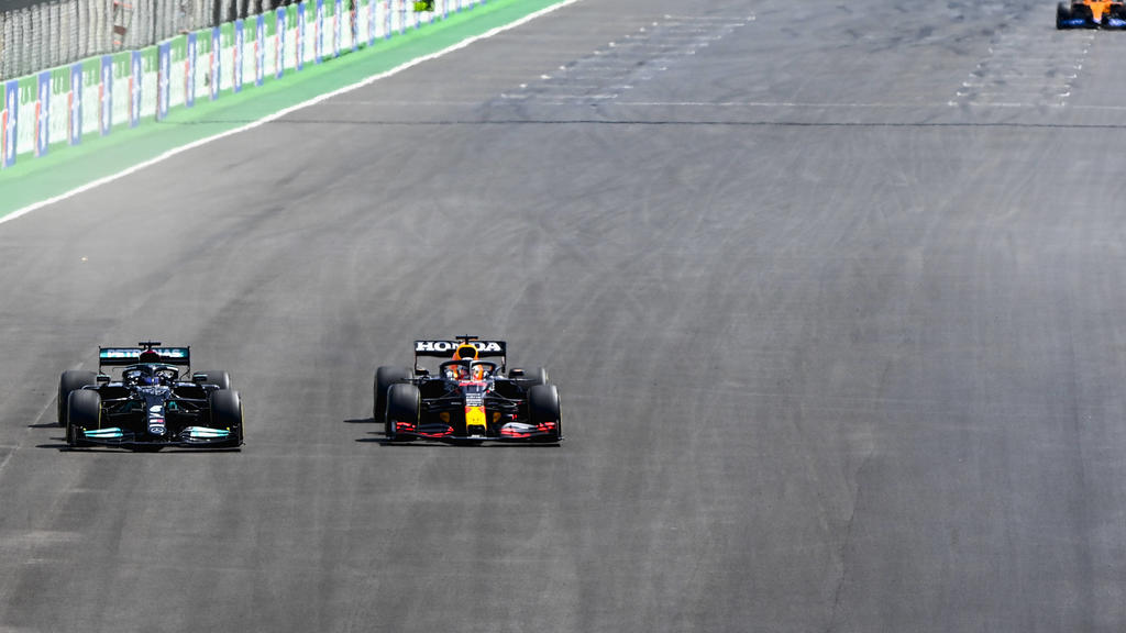 Formula 1 2021: Portuguese GP ALGARVE INTERNATIONAL CIRCUIT, PORTUGAL - MAY 02: Sir Lewis Hamilton, Mercedes W12, passes Max Verstappen, Red Bull Racing RB16B during the Portuguese GP at Algarve International Circuit on Sunday May 02, 2021 in Portim
