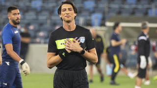 Referee Sapir Berman attends a warm-up before an Israeli Premier League soccer match between Hapoel Haifa and Beitar Jerusalem in the northern Israeli city of Haifa, Monday, May 3, 2021. Israeli soccer's first transgender soccer referee took the field Monday for the first time since coming out publicly as a woman last week. (AP Photo/Sebastian Scheiner)