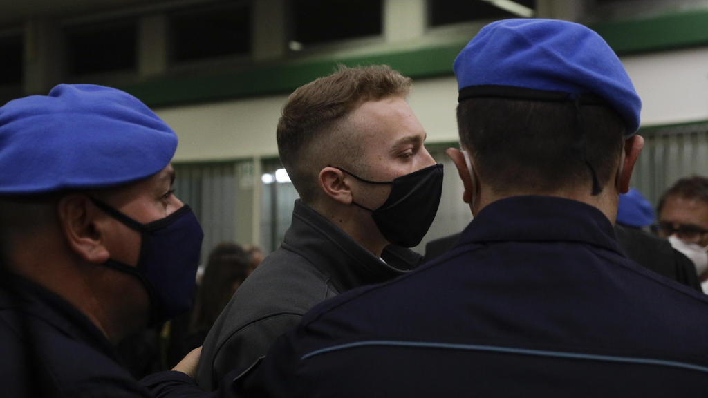 Finnegan Lee Elder leaves after listening to the verdict in the trial for the slaying of an Italian plainclothes police officer in summer 2019, in Rome, Wednesday, May 5, 2021. A jury in Rome on Wednesday convicted two American friends in the 2019 sl