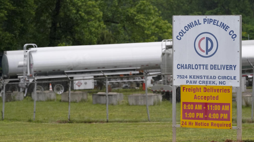 Tanker trucks are parked near the entrance of Colonial Pipeline Company Wednesday, May 12, 2021, in Charlotte, N.C. Several gas stations in the Southeast reported running out of fuel, primarily because of what analysts say is unwarranted panic-buyin