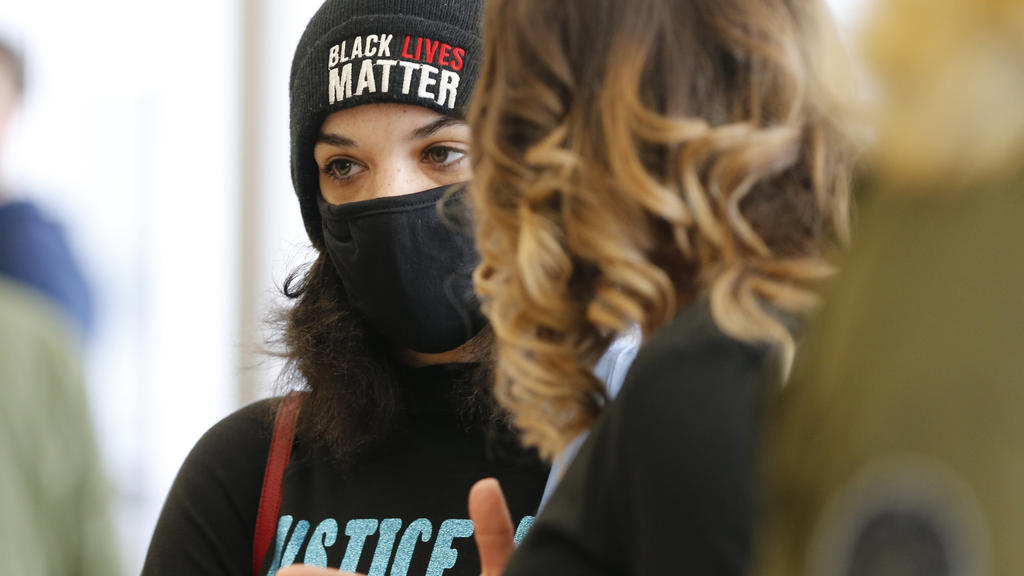 FILE - In this Friday, Feb. 5, 2021, file photo, Andre Hill's daughter Karissa Hill waits to enter the courtroom where former Columbus Police Officer Adam Coy was to be arraigned for the shooting death of Andre Hill, in Columbus, Ohio. Coy is set to