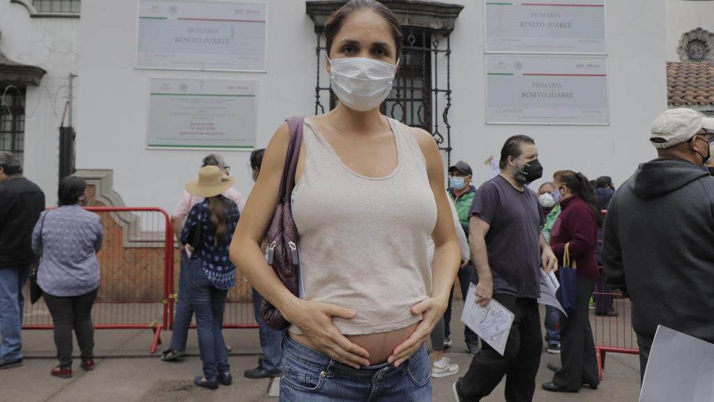 Vaccination Of Pregnant Women Against COVID-19 Begins In Mexico City A pregnant woman outside the facilities of the Benito Juarez Elementary School, located in the Cuauhtemoc district of Mexico City, before being immunized with the first dose of the