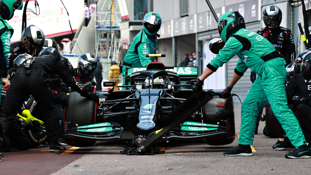 MONTE-CARLO, MONACO - MAY 23: Valtteri Bottas of Finland driving the (77) Mercedes AMG Petronas F1 Team Mercedes W12 makes a pitstop but his front right wheel is stuck on his car leading to his retirement from the race during the F1 Grand Prix of Mon