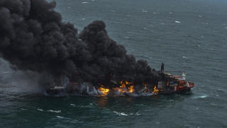 In this photo provided by Sri Lanka Air Force, smoke rises from the container vessel MV X-Press Pearl engulfed in flames off Colombo port, Sri Lanka, Tuesday, May 25, 2021. An explosion occurred Tuesday on a ship anchored off Sri Lanka's capital on which a fire had been burning for several days, prompting the evacuation of all crew members, officials said. (Sri Lanka Air Force via AP)
