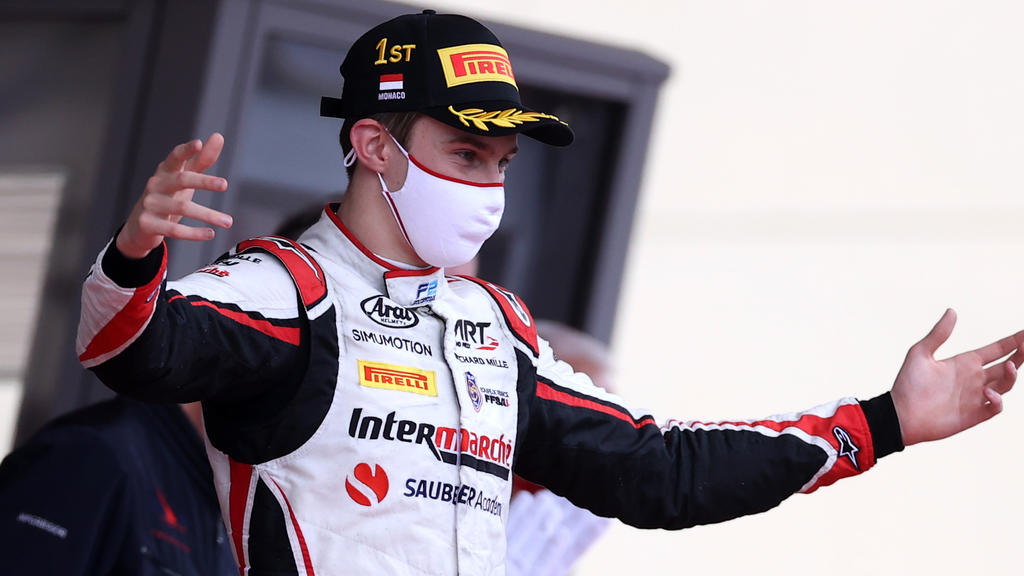 MONTE-CARLO, MONACO - MAY 22: Race winner Theo Pourchaire of France and ART Grand Prix celebrates on the podium during the Feature Race of Round 2:Monte Carlo of the Formula 2 Championship at Circuit de Monaco on May 22, 2021 in Monte-Carlo, Monaco.