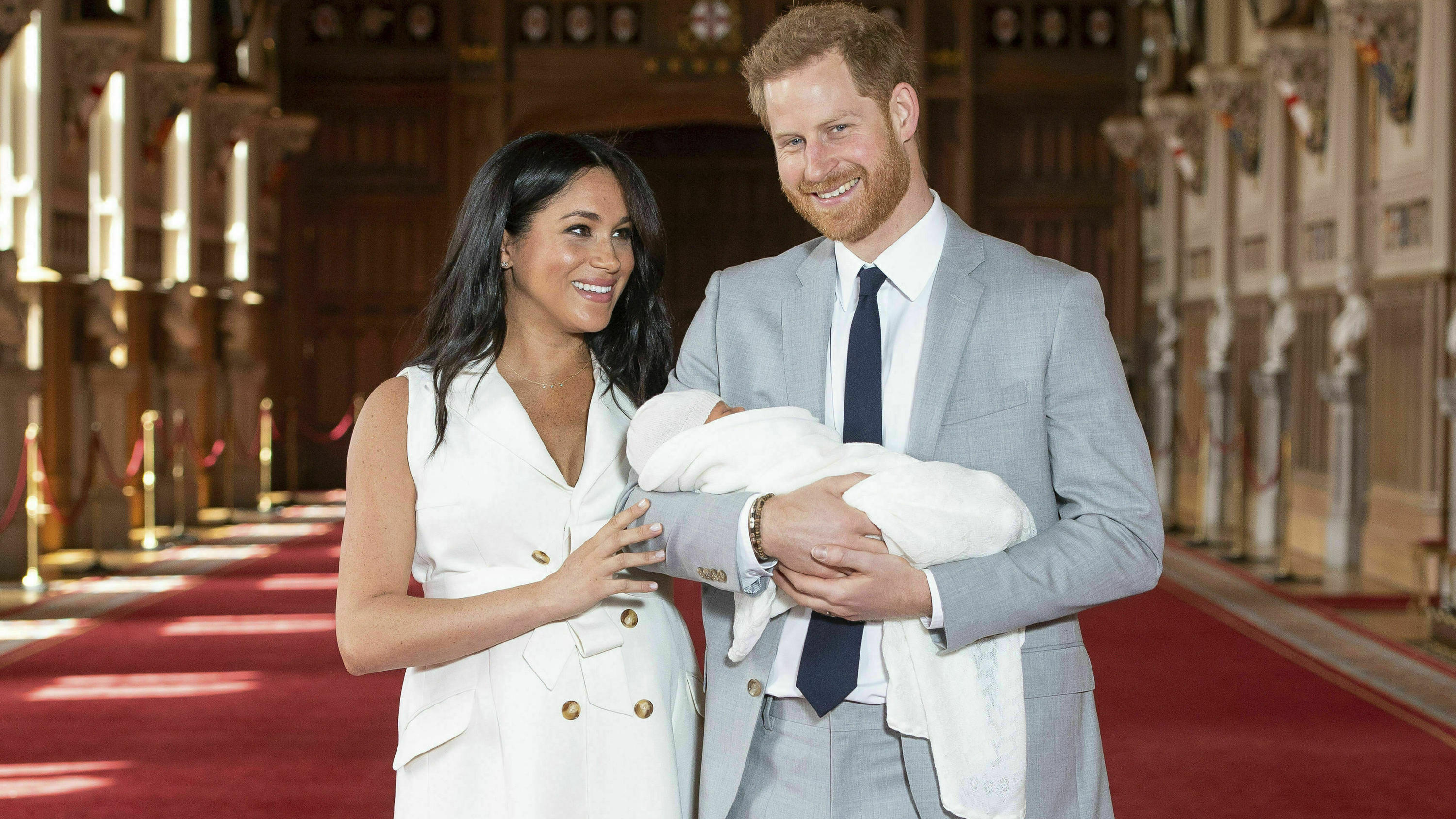 FILE - Britain's Prince Harry and Meghan, Duchess of Sussex, pose with their newborn son Archie Harrison Mountbatten-Windsor in St George's Hall at Windsor Castle, Windsor, south England, on May 8, 2019. It won't be long before Archie is a big brothe