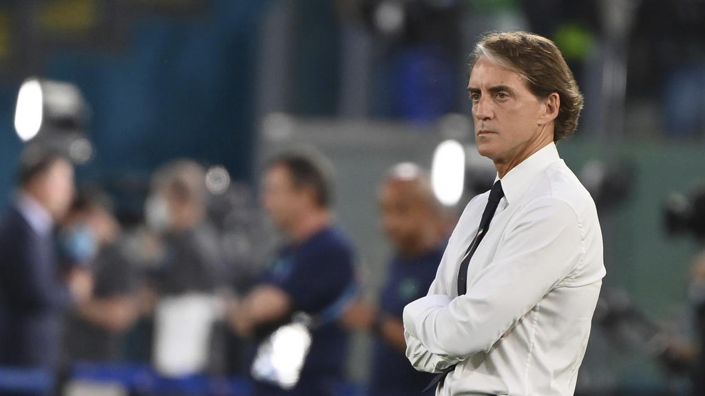Italy coach Roberto Mancini stands on the pitch prior to the start of the Euro 2020 group A soccer match between Italy and Switzerland, in Rome's Olympic Stadium, Wednesday, June 16, 2021. (Alfredo Falcone/LaPresse via AP)