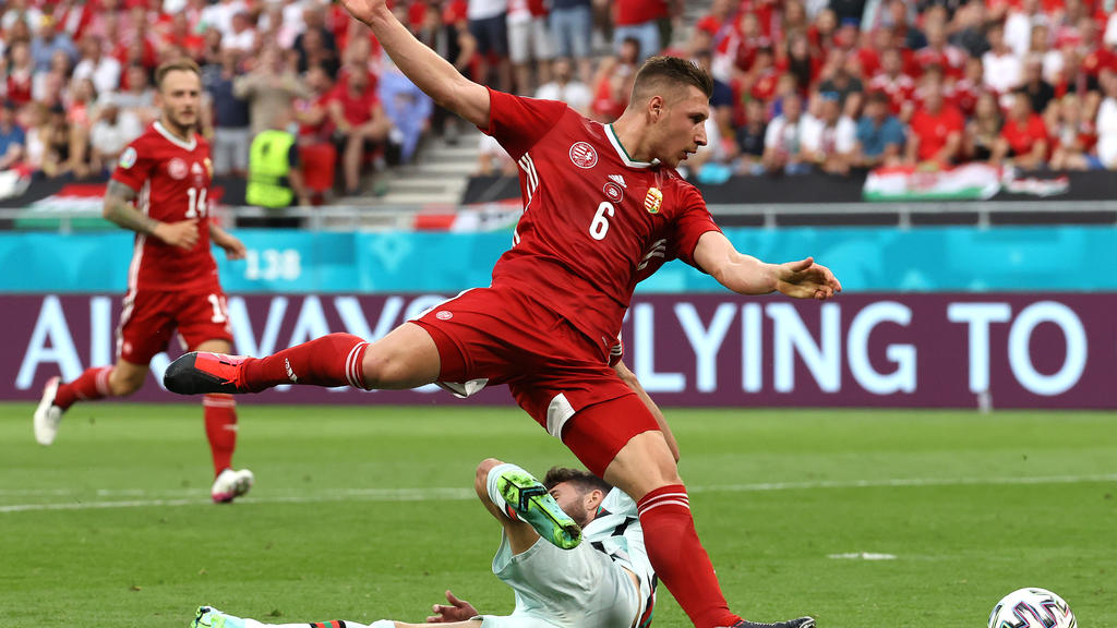 BUDAPEST, HUNGARY - JUNE 15: Rafa Silva of Portugal is fouled by Willi Orban of Hungary leading to a penalty being awarded during the UEFA Euro 2020 Championship Group F match between Hungary and Portugal at Puskas Arena on June 15, 2021 in Budapest,
