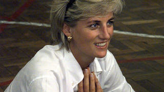 FILE - In this Saturday, Aug. 9, 1997 file photo, Diana, Princess of Wales, sits and talks to members of a Zenica volleyball team who have suffered injuries from mines, during her visit to Zenica, Bosnia. For someone who began her life in the spotlight as â€œShy Di,â€ Princess Diana became an unlikely, revolutionary during her years in the House of Windsor. She helped modernize the monarchy by making it more personal, changing the way the royal family related to people. By interacting more intimately with the public -- kneeling to the level of children, sitting on edge of a patientâ€™s hospital bed, writing personal notes to her fans -- she set an example that has been followed by other royals as the monarchy worked to become more human and remain relevant in the 21st century.  (Ian Waldie/Pool via AP, File)