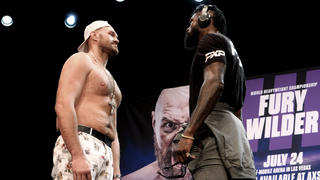 Tyson Fury, left and Deontay Wilder face off at a news conference in Los Angeles on Tuesday, June 15, 2021. The two are scheduled to fight in a heavyweight boxing bout July 24 in Las Vegas. (AP Photo/Richard Vogel)