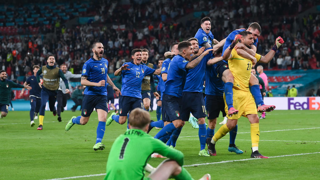 LONDON, ENGLAND - JULY 11: Gianluigi Donnarumma of Italy celebrates with teammates after saving the England fifth penalty taken by Bukayo Saka (Not pictured) of England in a penalty shoot out during the UEFA Euro 2020 Championship Final between Italy