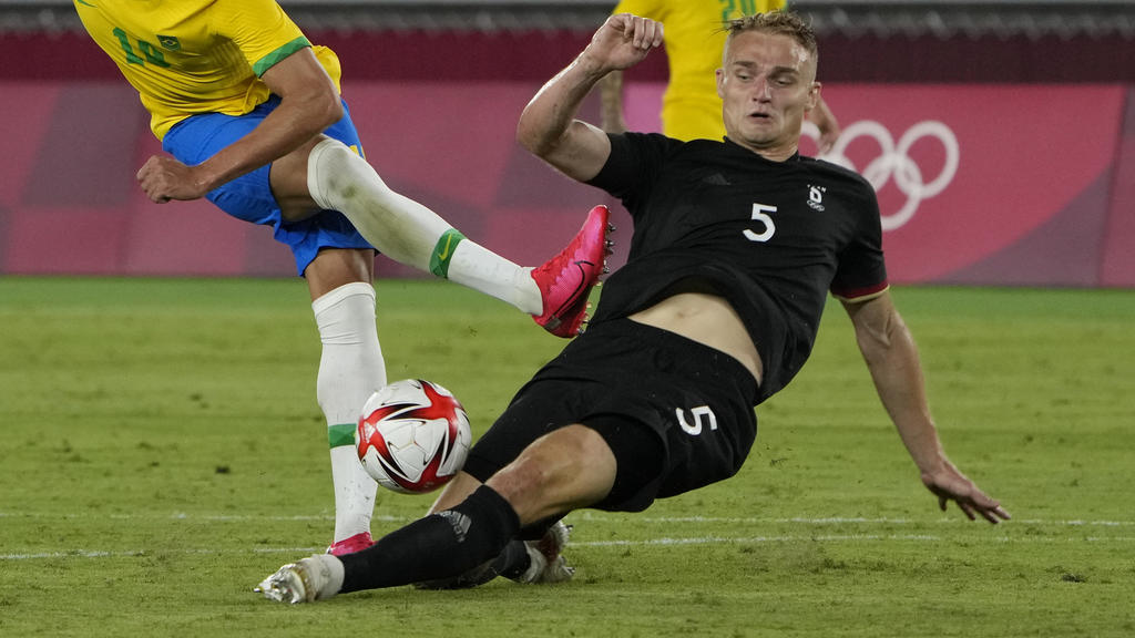 Germany's Amos Pieper blocks Brazil's Richarlison during a men's soccer match at the 2020 Summer Olympics, Thursday, July 22, 2021, in Yokohama, Japan. (AP Photo/Kiichiro Sato)