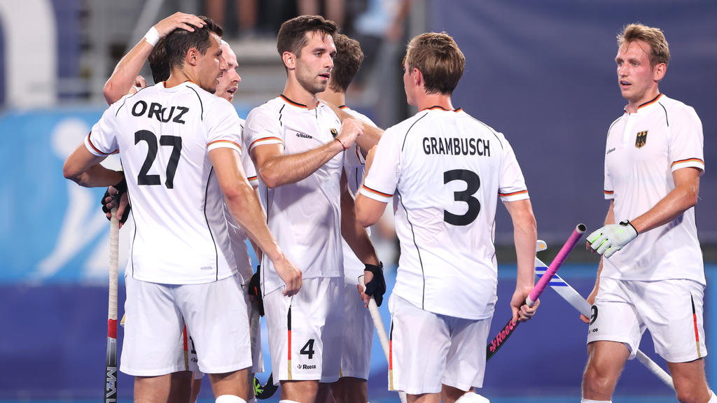TOKYO, JAPAN - JULY 24: Lukas Windfeder of Team Germany celebrates with teammate Mats Jurgen Grambusch after scoring their team's fourth goal during the Men's Preliminary Pool B match between Canada and Germany on day one of the Tokyo 2020 Olympic Ga