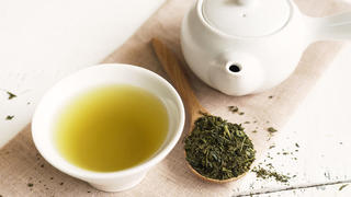 Japanese green tea on white wooden table