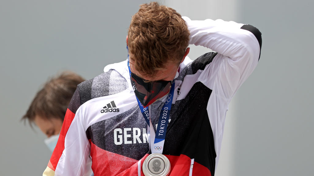 TOKYO, JAPAN - JULY 30: Silver medalist Hannes Ocik of Team Germany reacts following the medal ceremony for the Men's Eight Final A on day seven of the Tokyo 2020 Olympic Games at Sea Forest Waterway on July 30, 2021 in Tokyo, Japan. (Photo by Naom