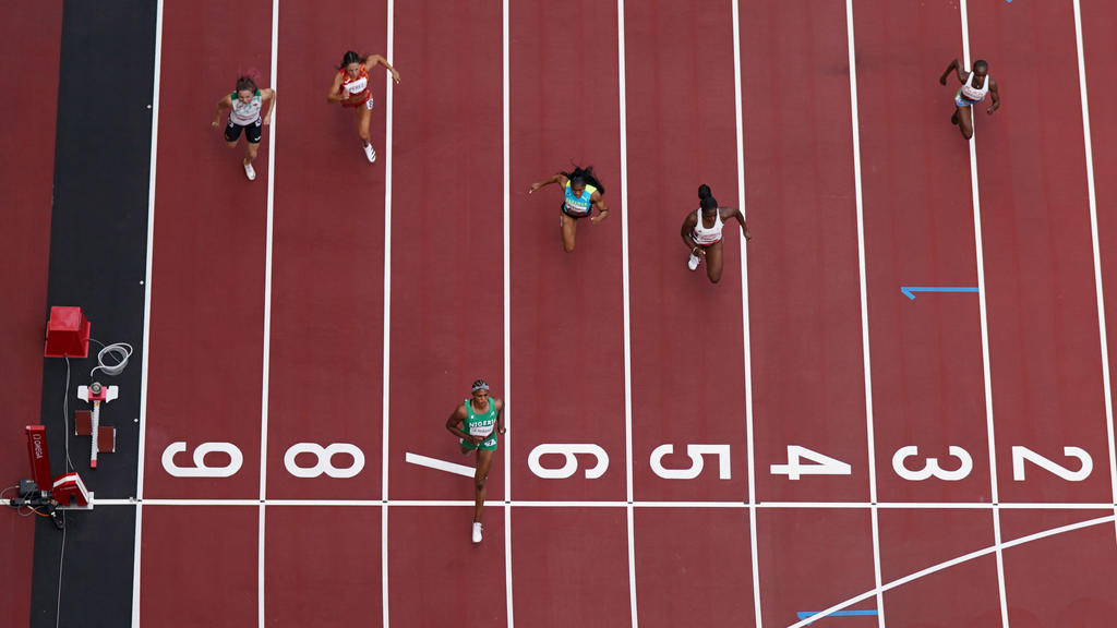 Tokyo 2020 Olympics - Athletics - Women's 100m - Round 1 - OLS - Olympic Stadium, Tokyo, Japan - July 30, 2021. Blessing Okagbare of Nigeria crosses the line to win Heat 6 REUTERS/Pawel Kopczynski