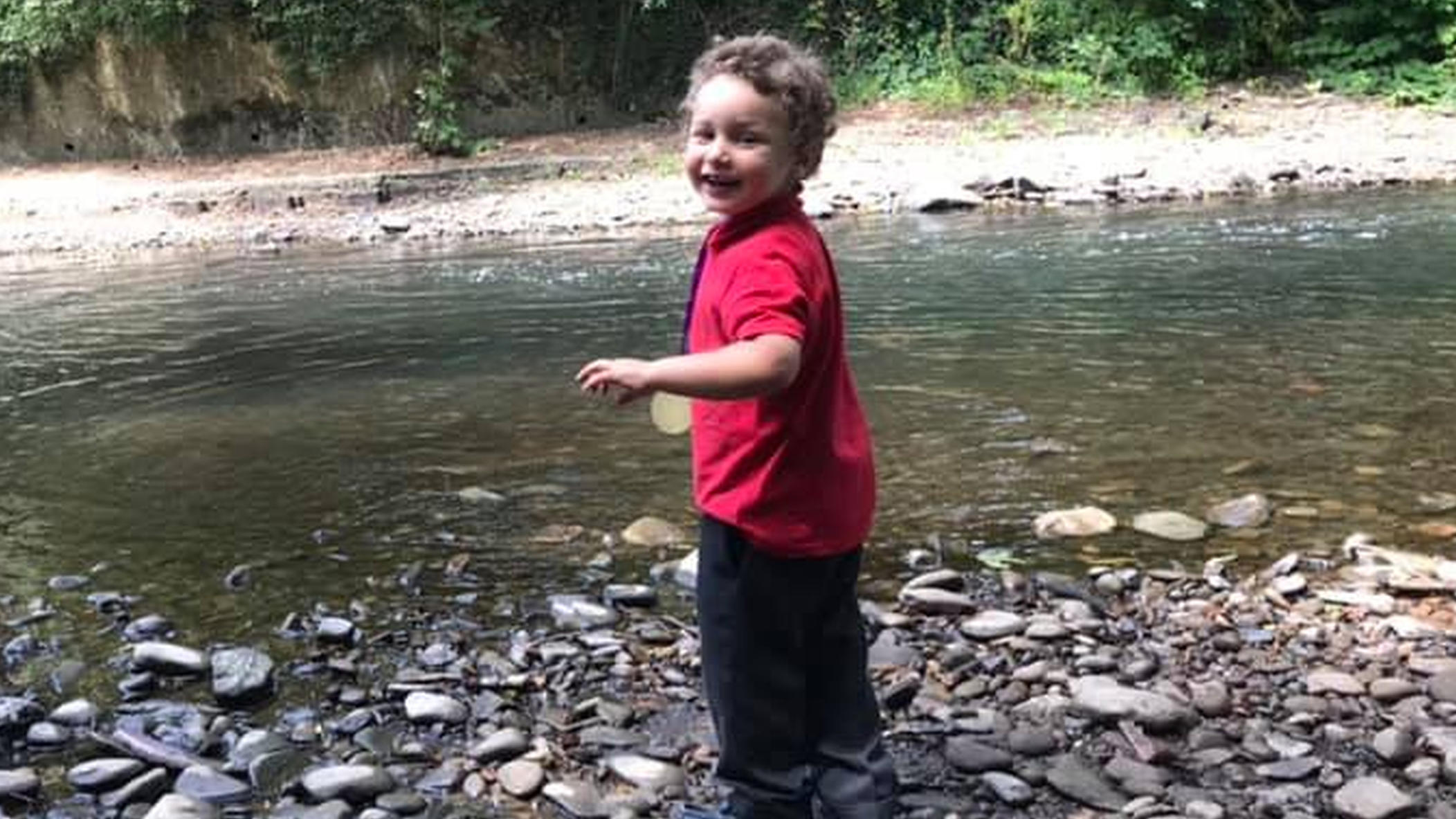 Pictured: The five year old who died in Ogmore river, named locally as Logan Williamson, pictured by Ogmore river on July 2019.Re: South Wales Police can confirm that  three people have been arrested following reports of concerns for a missing 5 year