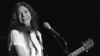 FILE - Nanci Griffith performs during the ACLU Freedom Concert Oct. 4, 2004, in New York. Griffith, the Grammy-winning folk singer-songwriter from Texas whose literary songs like â€œLove at the Five and Dimeâ€ celebrated the South, has died. She was 68. A statement from her management company on Friday, Aug. 13, 2021, confirmed her death, but no cause of death was provided. (AP Photo/Julie Jacobson, File)