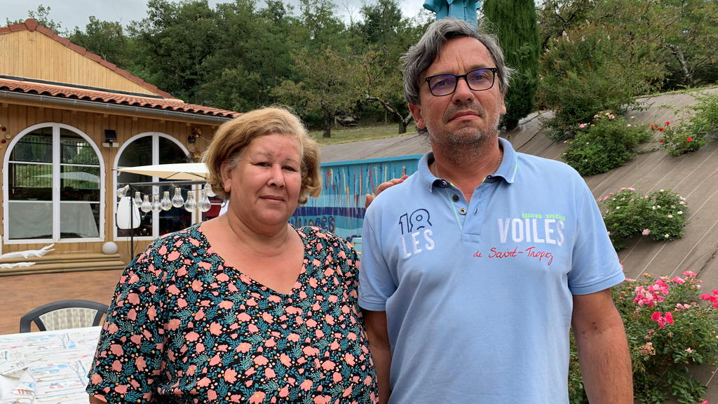 Jeanne Pouchain poses with her husband Pierre-Jean Pouchain during an interview with Reuters at her home, detailing the ordeal she has been leaving through since being declared dead by a judge, in Saint-Joseph, near Lyon, August 30, 2021. Picture tak