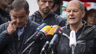 FILE - In this Tuesday, Aug.3, 2021 file photo Armin Laschet, top canditate of the German Christian Democrats for the federal elections, and Olaf Scholz, top canditate of the German Social Democrats, address the media during a press conference in Stolberg, Germany that was hit by heavy rain and floods. A large chunk of the German electorate remains undecided going into an election that will determine who succeeds Angela Merkel as chancellor after 16 years in power. Recent surveys show that support for German political parties has flattened out, with none forecast to receive more than a quarter of the vote. (Marius Becker/DPA via AP, Pool, file)