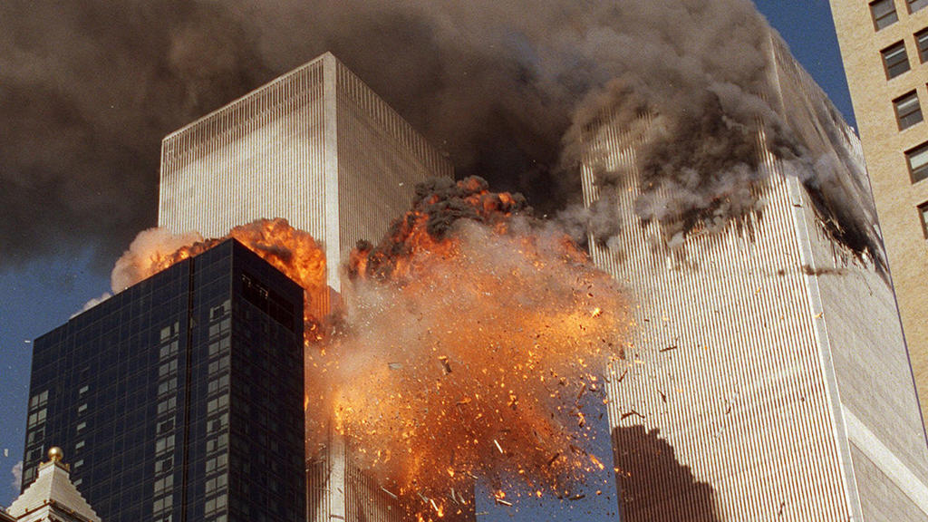 FILE - In this Sept. 11, 2001, file photo, smoke billows from one of the towers of the World Trade Center and flames as debris explodes from the second tower in New York. Relatives of the victims of the Sept. 11 attacks called Thursday, Sept. 2, for