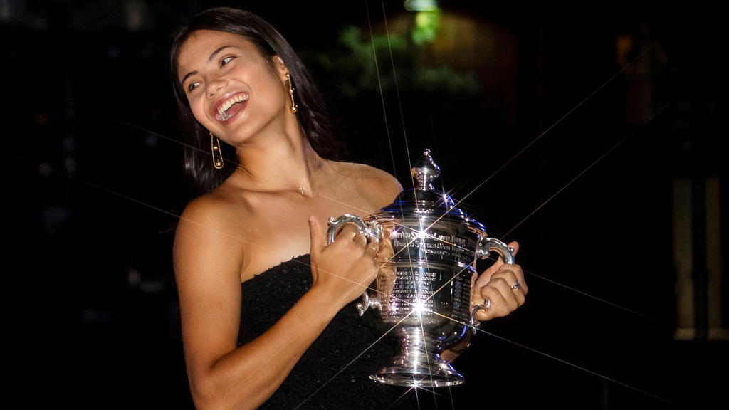 Britain's Emma Raducanu poses with the U.S. Open tennis championship trophy after her match against Leylah Fernandez of Canada in the women's singles final the 2021 U.S. Open tennis tournament at USTA Billie Jean King National Tennis Cent