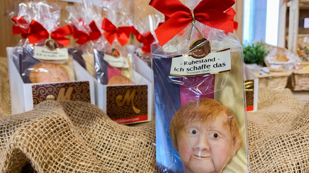 Marzipan cookies depicting German Chancellor Angela Merkel made by a German confectioner ahead of the September 26 elections, are displayed in Weilbach, Germany, September 14, 2021. REUTERS/Annkathrin Weis