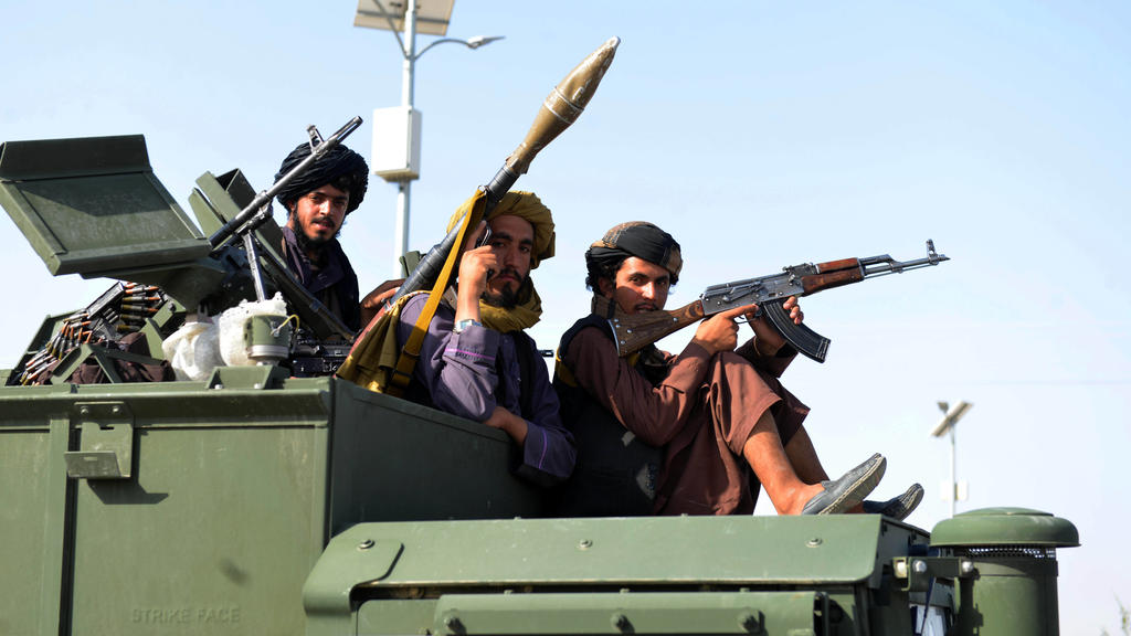 Afghanistan, Taliban in Kandahar 210902 -- KANDAHAR, Sept. 2, 2021 -- Taliban members are seen on a military vehicle on the street in Kandahar city, southern Afghanistan, Sept. 1, 2021. Photo by /Xinhua AFGHANISTAN-KANDAHAR-TALIBAN SanaullahxSeaim PU