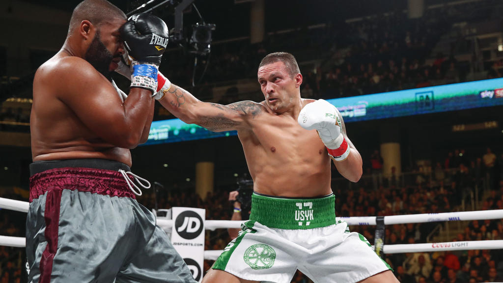 FILE - In this Saturday, Oct. 12, 2019 file photo, Oleksandr Usyk, right, hits Chazz Witherspoon during a heavyweight boxing bout, in Chicago. Usyk is scheduled to take on Anthony Joshua for the heavyweight title, at the London Tottenham Hotspur Stad