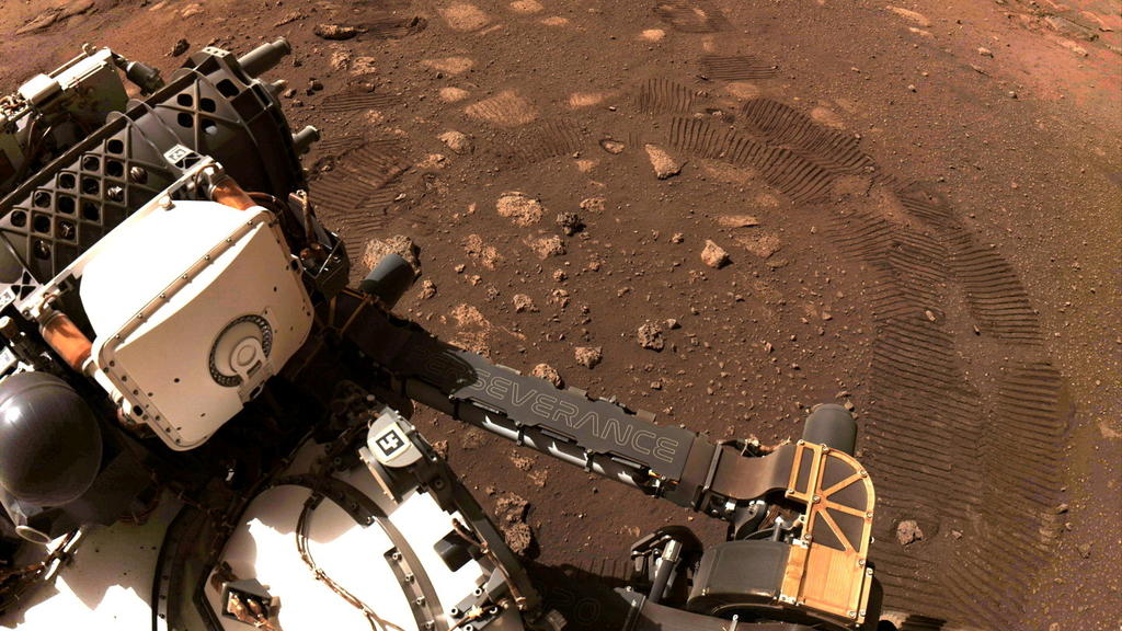 FILE PHOTO: Wheel tread marks are left in the soil of Jezero Crater on Mars, as NASA's Mars rover Perseverance drives on Martian surface for the first time, in this March 4, 2021 image supplied to Reuters. Image taken March 4, 2021. NASA/JPL-Caltech/